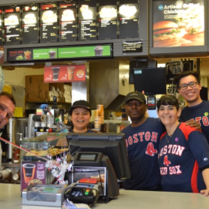 Huzzah! I walk into McDonald's to buy the busker a bottle of water, and these smiling folks are celebrating Opening Day. McDonald's doesn't dress up like this for every Red Sox game, and the employees are jovial and even the manager pokes his head to join in the excitement of Opening Day. This is what felt like the most detailed, when even in the work place everyone's spirits are lifted.